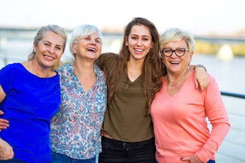 Group of women of different ages smiling