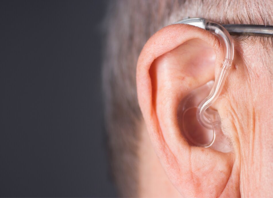Man with hearing aid in right ear