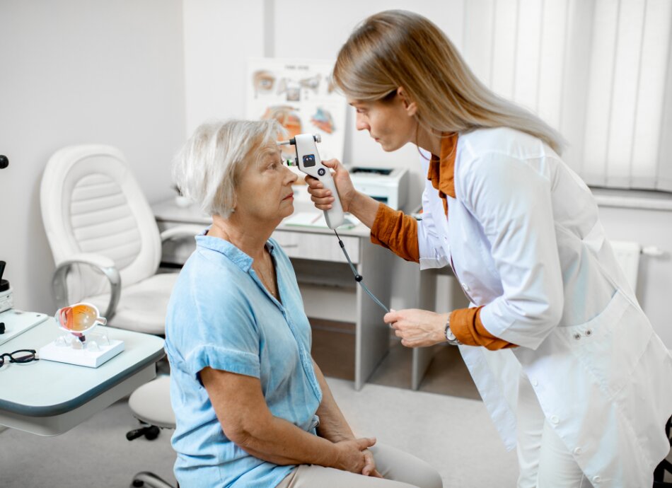 Woman getting an eye pressure test by optometrist