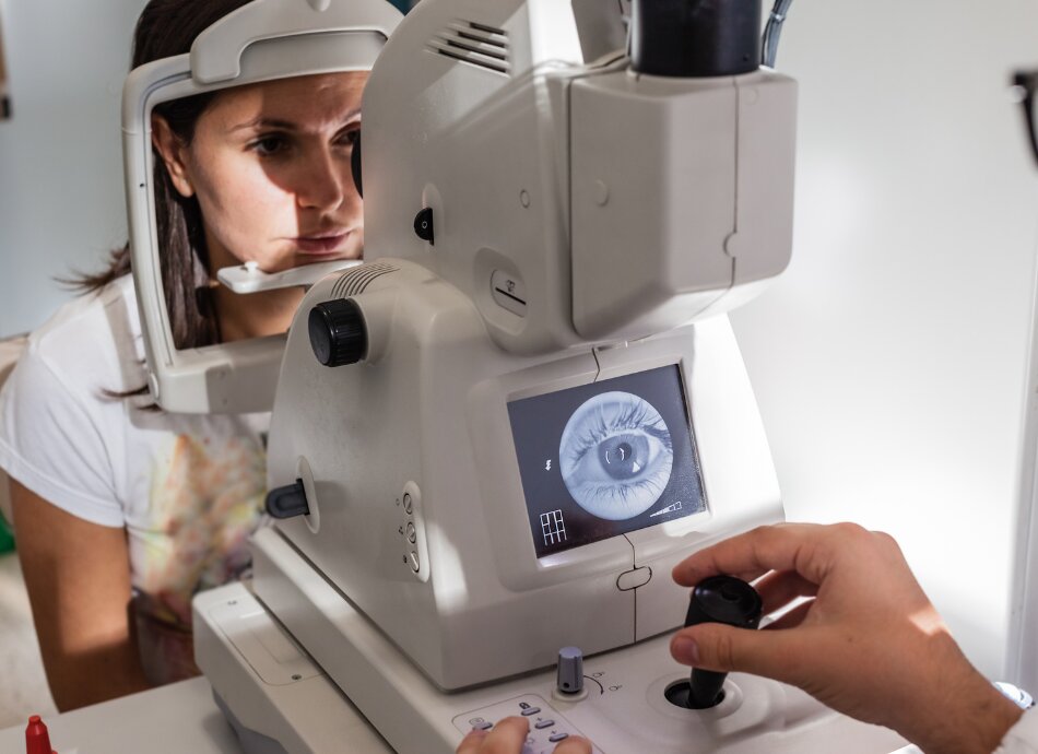 Woman getting retinal camera eye check