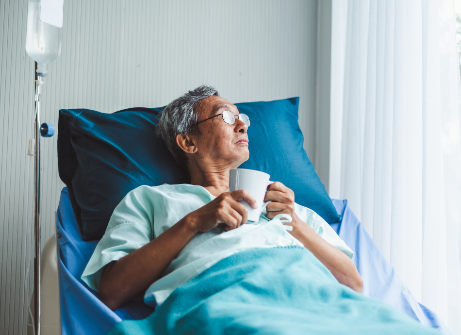 Older man waits in hospital bed