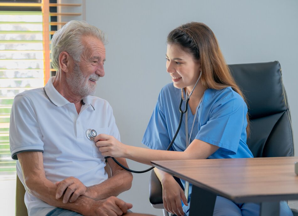 Older man having heart checked with stethoscope