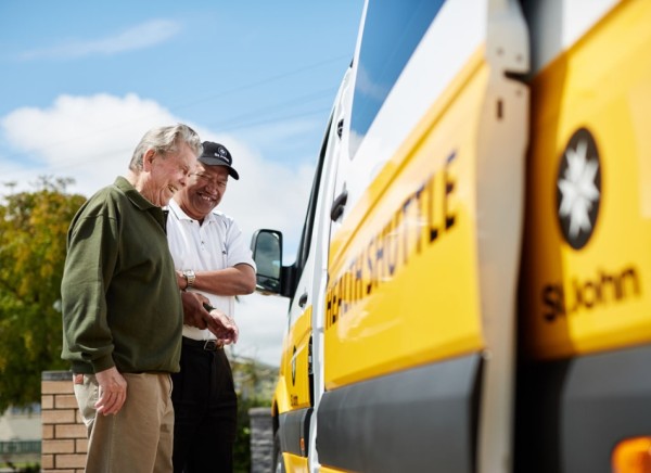 Older man being helped into St John Health Shuttle