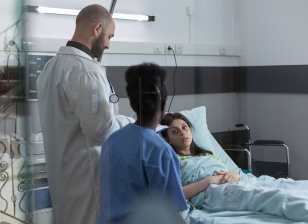 Woman in hospital bed overseas