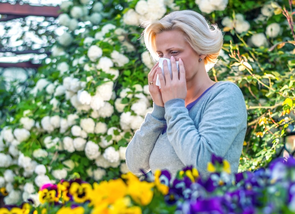 Woman hayfever in garden 