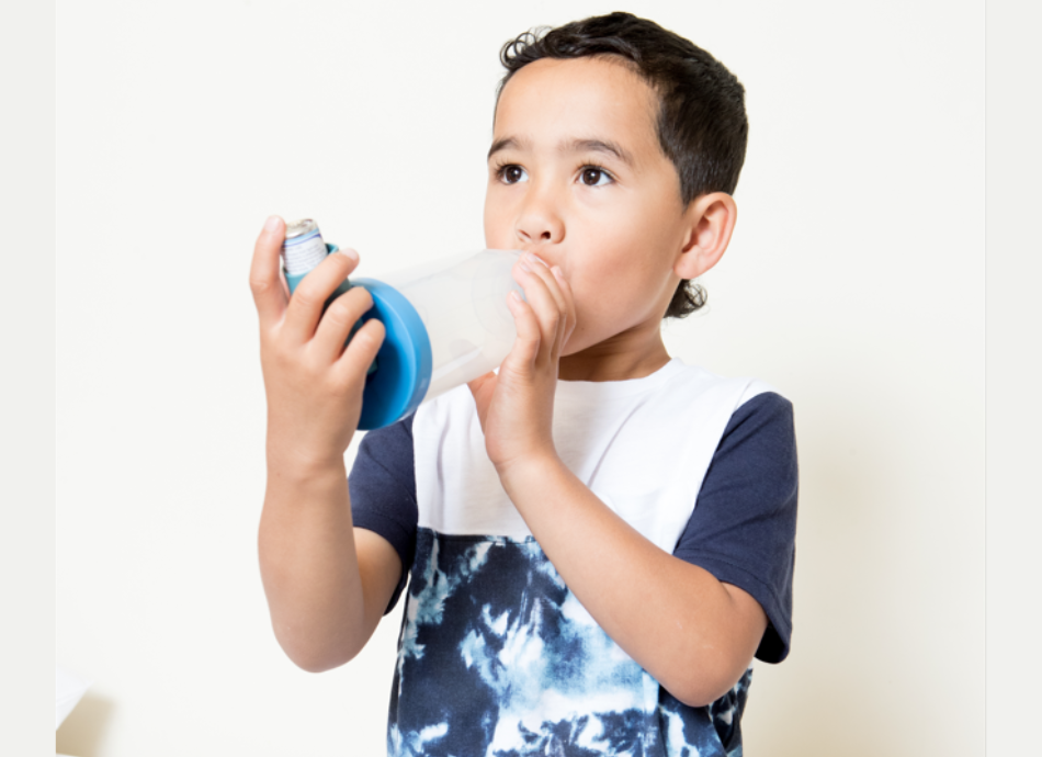 Boy using inhaler with spacer ARFNZ 
