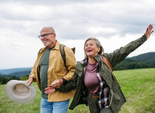 Older happy couple walking in outdoors