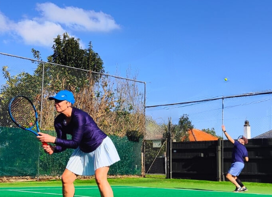 Couple playing tennis