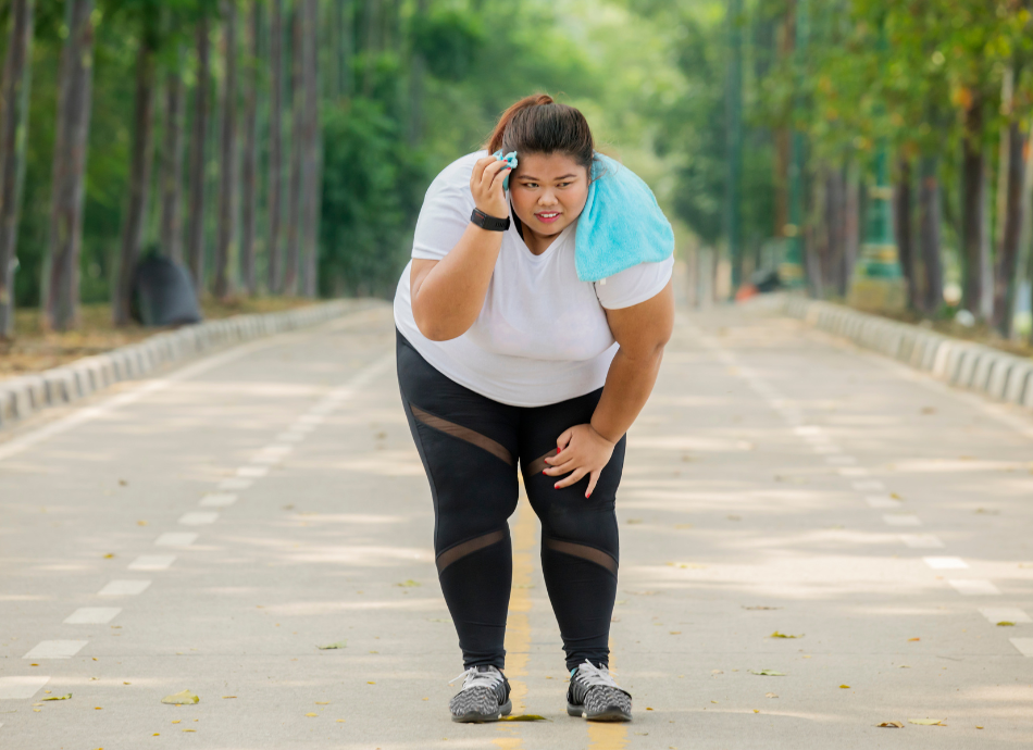 Larger young woman out of breath while running