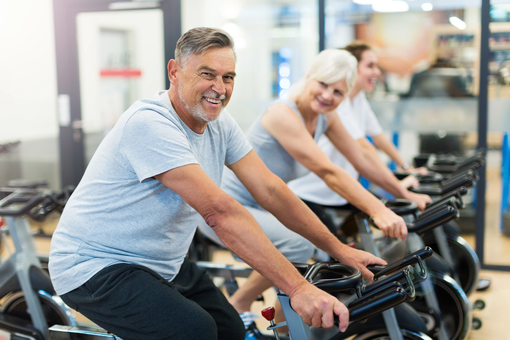 Older adults doing cycle class