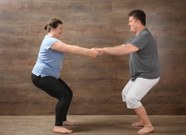 Couple doing physical exercises