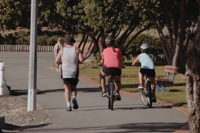 Family running and cycling together 