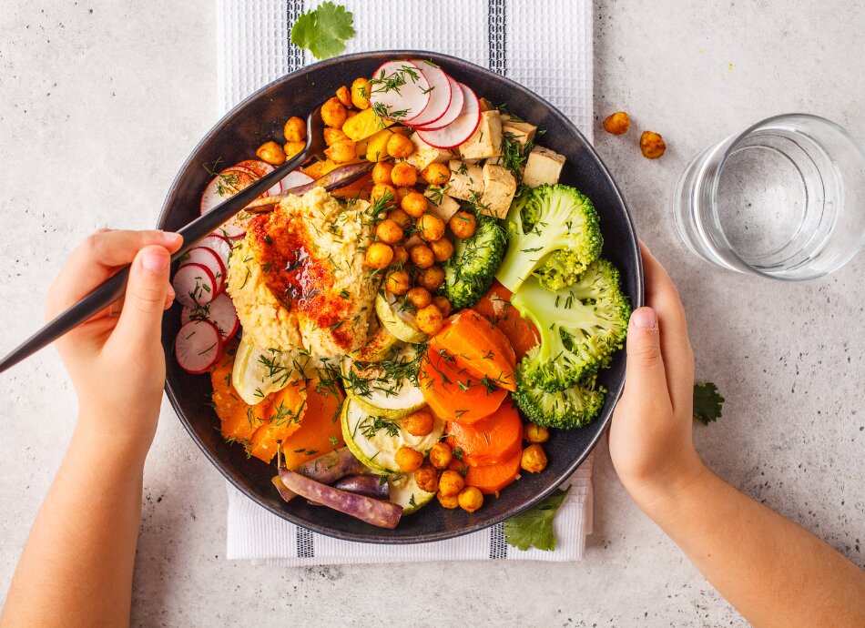 Child with vegan meal and water 