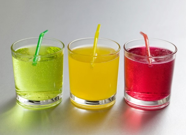 Coloured soft drinks with straws