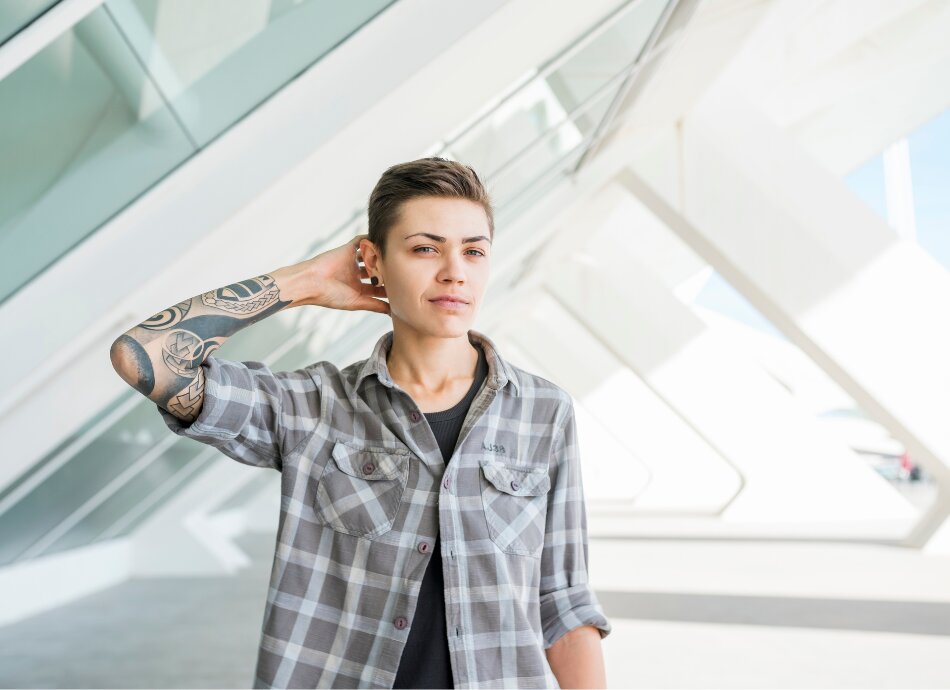 Transgender person with tattoo canva 950x690