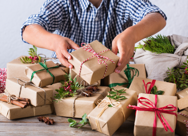 Brown paper ribbon and greenery wrapped parcels