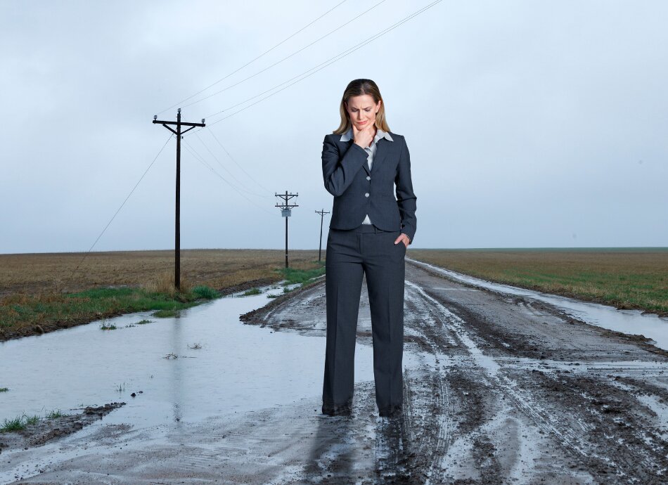 Businesswoman stuck in the mud