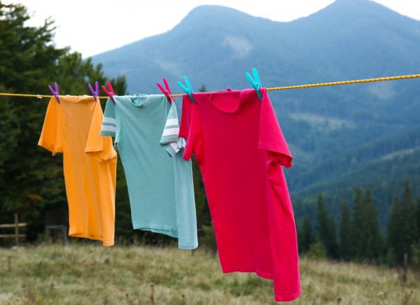 Coloured t-shirts hanging on a washing line