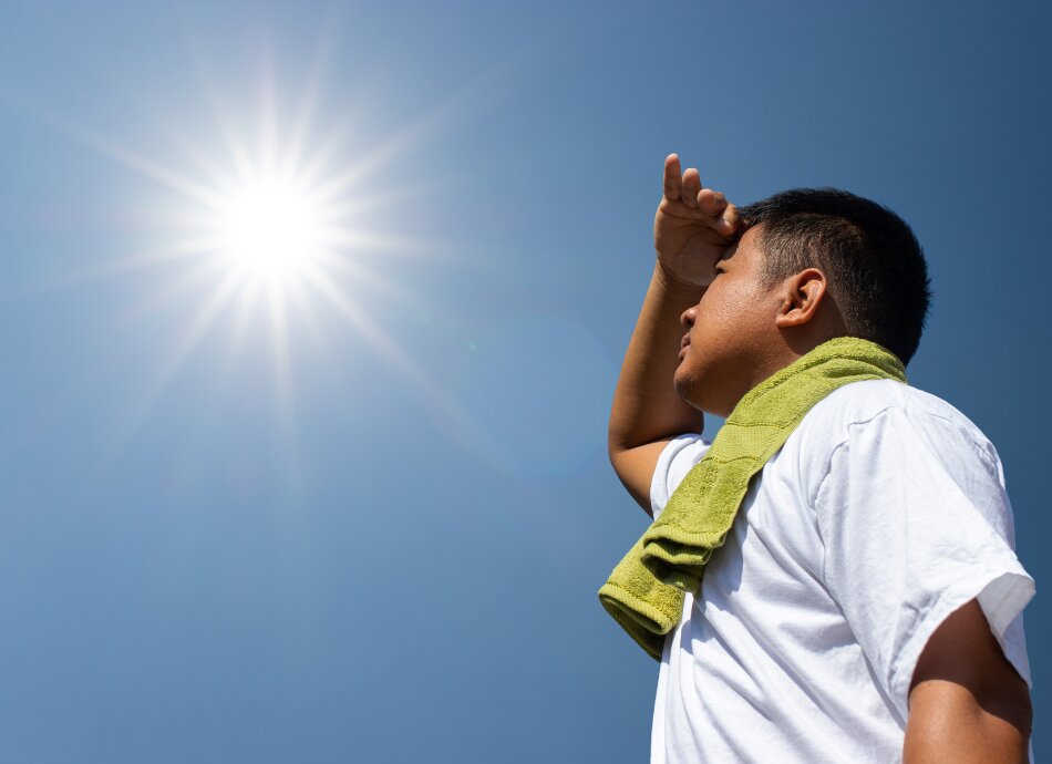 Man looking up at bright sun canva 950x690