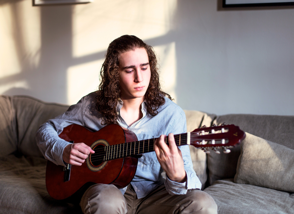 Teenager playing guitar 