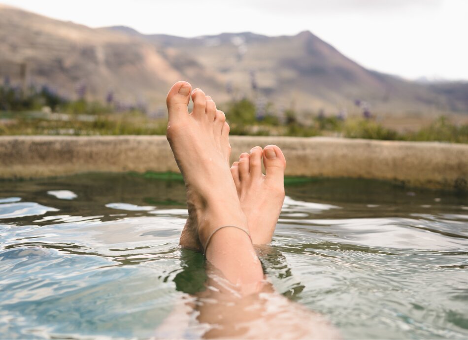 View of woman's feet in a hot tub
