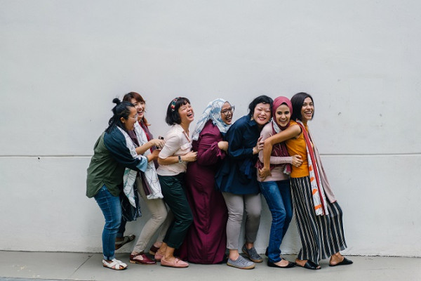 Group of women of different nationalities laughing