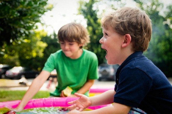 Two young boys having fun playing outdoors