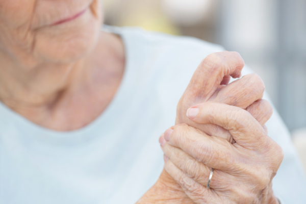 Woman massaging sore hands