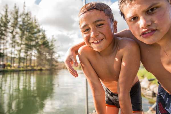 Kiwi boys who've been swimming in New Zealand river