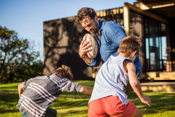 Kiwi dad plays rugby with young sons