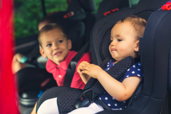 Children in their carseats in the family car