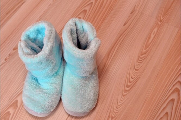 Blue slippers on a wooden floor 