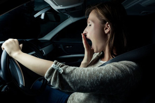 Woman falling asleep when driving