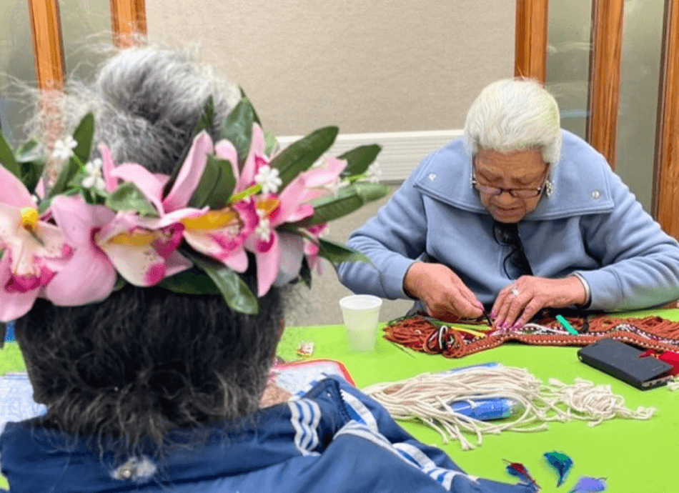 Pasifika woman demonstrating weaving