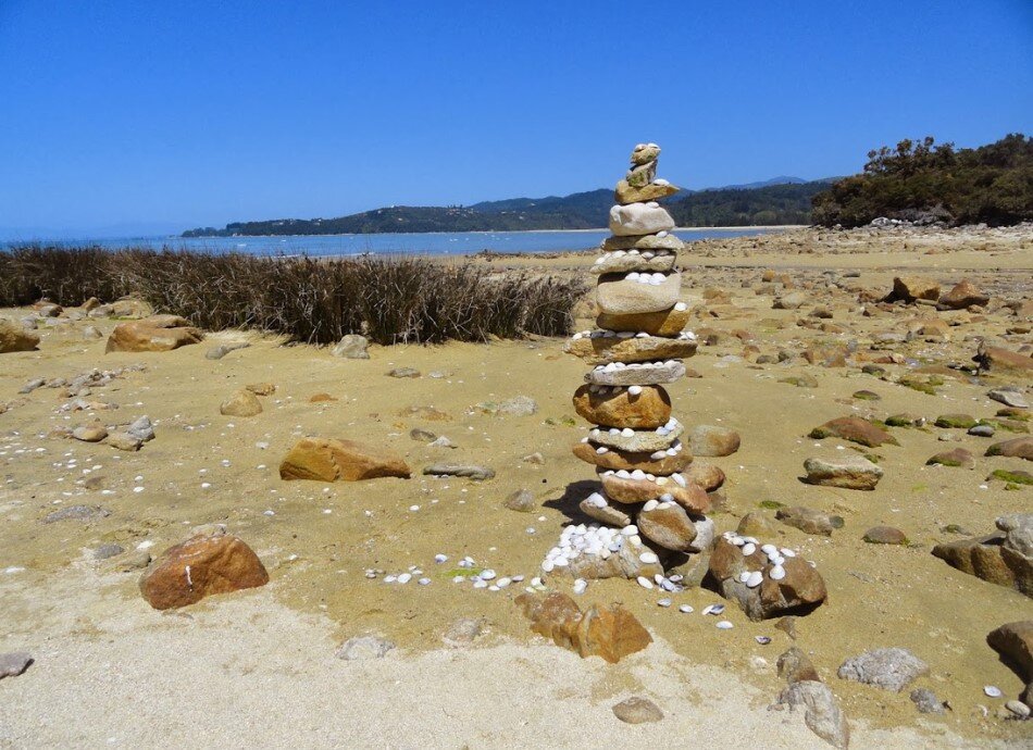 Rock cairn on beach Abel Tasman National Park NZ