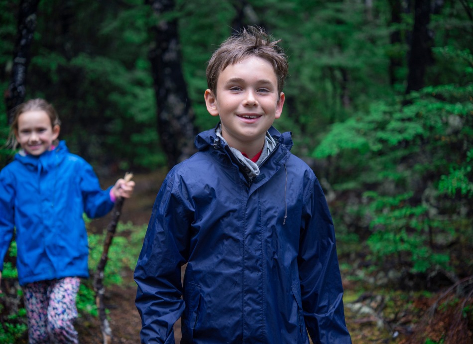 children hiking in New Zealand bush Canva