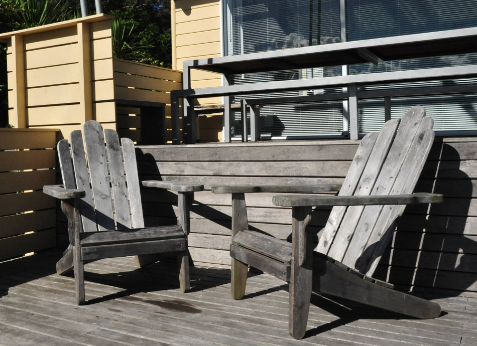 two chairs outside at a bach New Zealand Canva