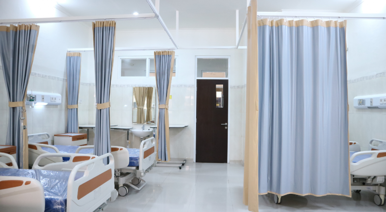 Hospital ward with empty beds