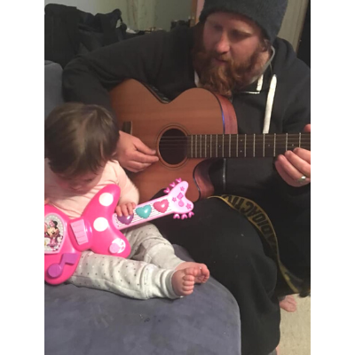 Josh from Big Buddy programme plays guitar to his daughter, Ruby